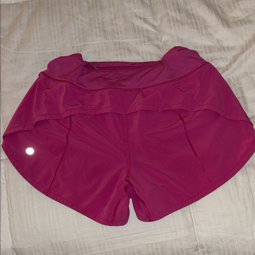 Lululemon Pink Athletic Shorts with Curved Waistband and Side Vents